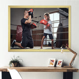 Young Trainer Training A Little Girl Boxer - Sport Boxer Canvas Wall Art