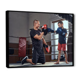 Young Trainer Training A Little Boy Boxer - Sport Boxer Canvas Wall Art