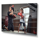 Young Trainer Training A Little Girl Boxer - Sport Boxer Canvas Wall Art