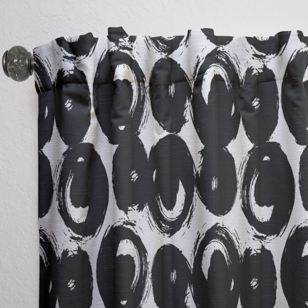Curtain with black abstract circular pattern on a white background