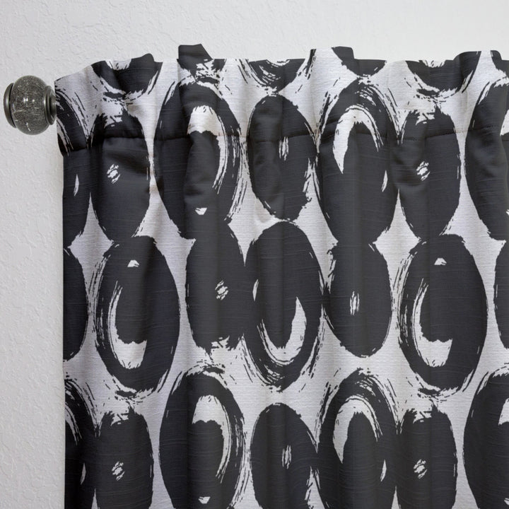 Curtain with black abstract circular pattern on a white background