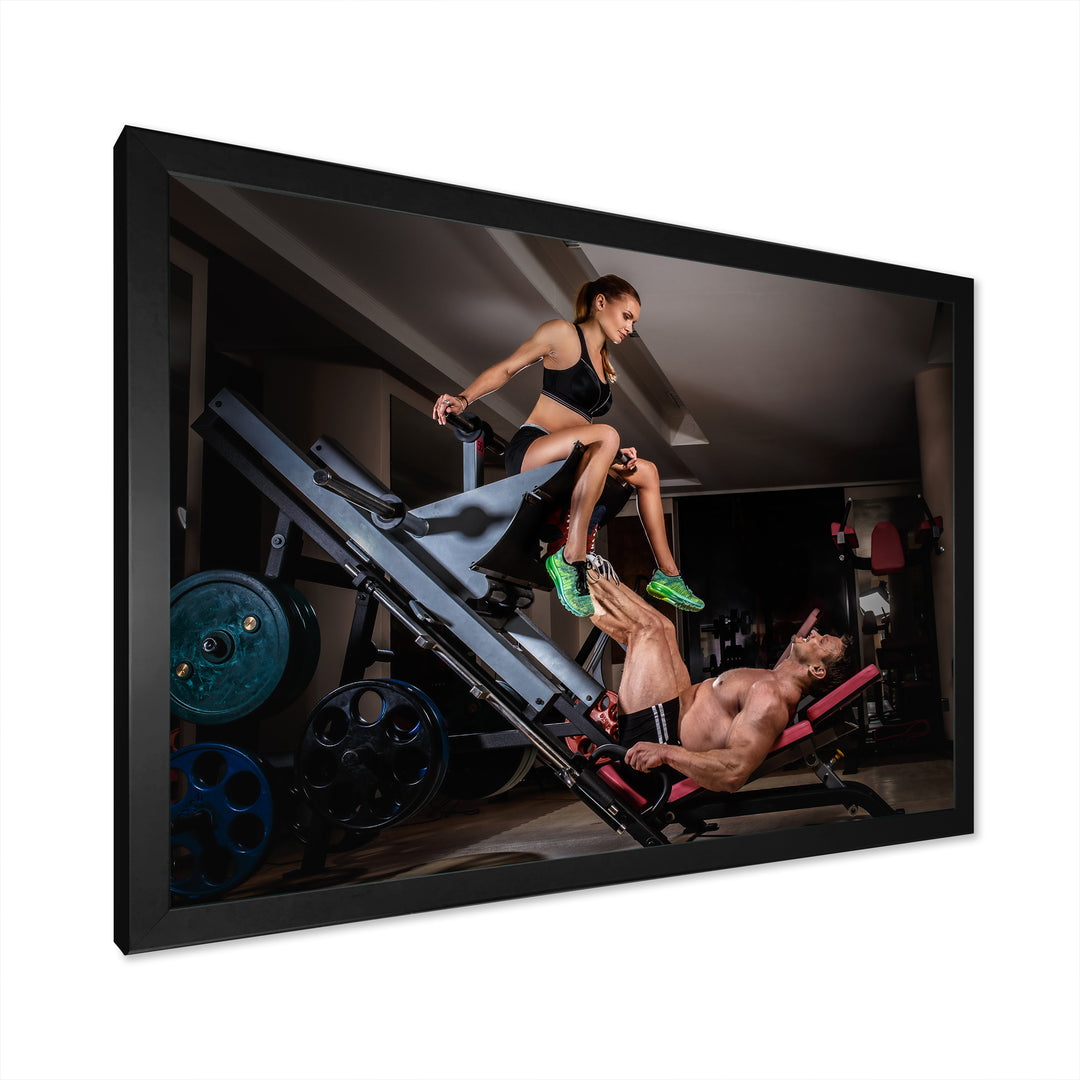 Man Doing Leg Presses With His Trainer - Aerobic &amp; Bodybuilding Canvas Wall Art