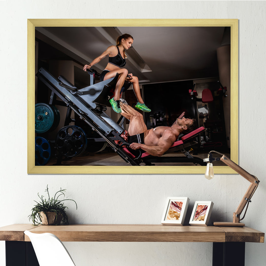 Man Doing Leg Presses With His Trainer - Aerobic &amp; Bodybuilding Canvas Wall Art