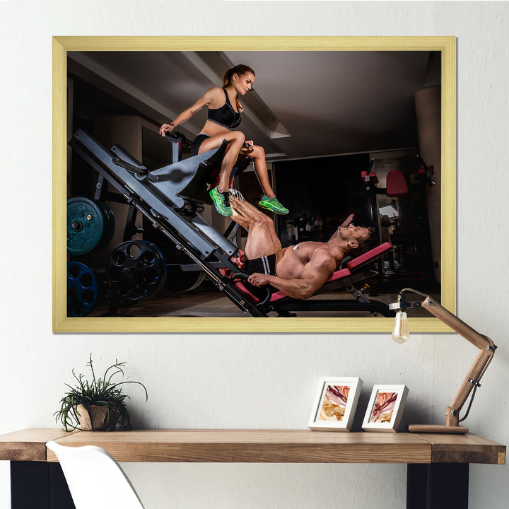 Man Doing Leg Presses With His Trainer - Aerobic &amp; Bodybuilding Canvas Wall Art