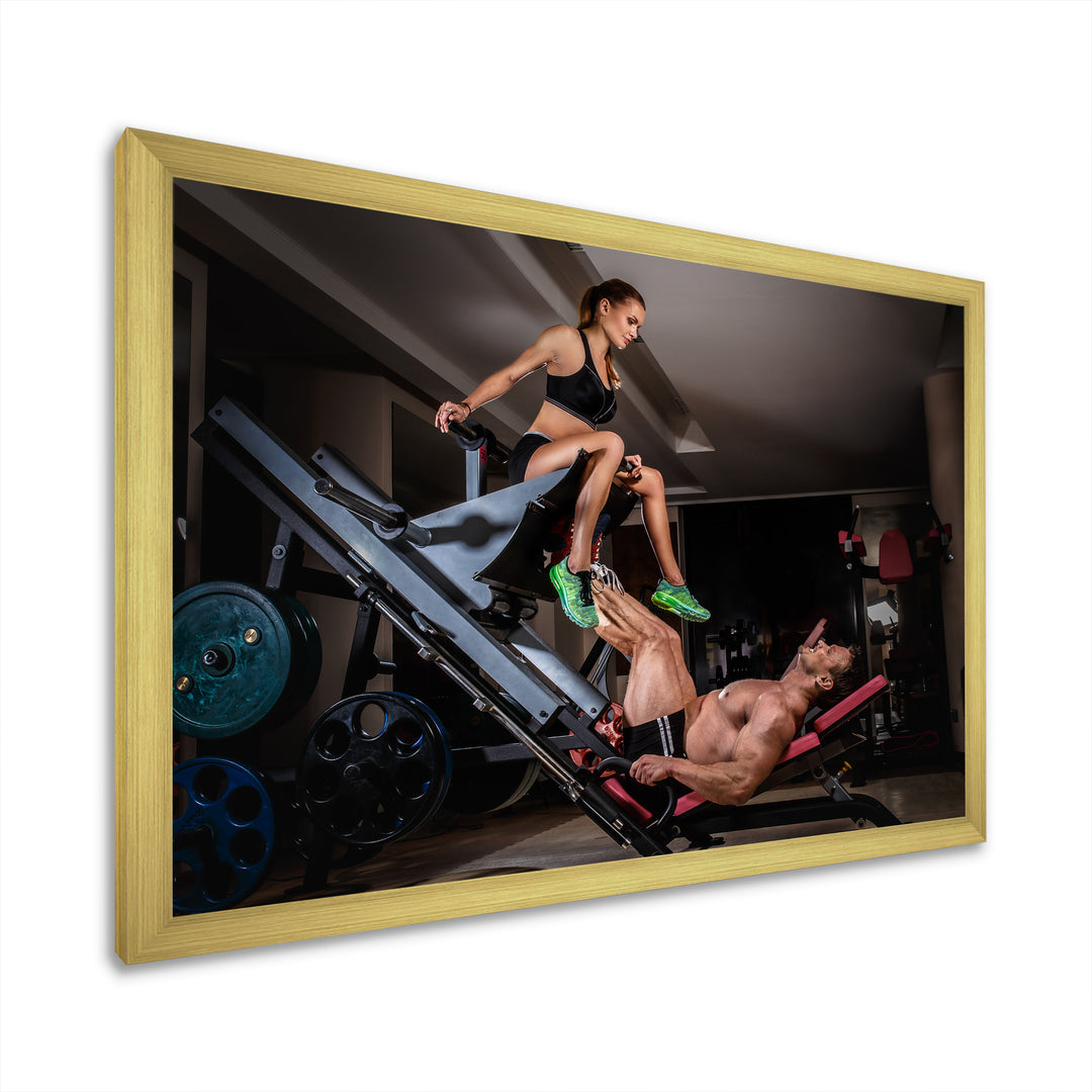 Man Doing Leg Presses With His Trainer - Aerobic &amp; Bodybuilding Canvas Wall Art