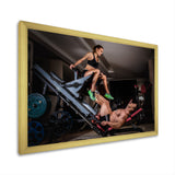 Man Doing Leg Presses With His Trainer - Aerobic & Bodybuilding Canvas Wall Art