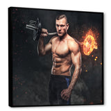 Muscular Athletic Male Holds Burning Barbell - Aerobic & Bodybuilding Canvas Wall Art
