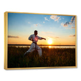 Man Training Karate In Field At Sunrise - Aerobic & Bodybuilding Canvas Wall Art