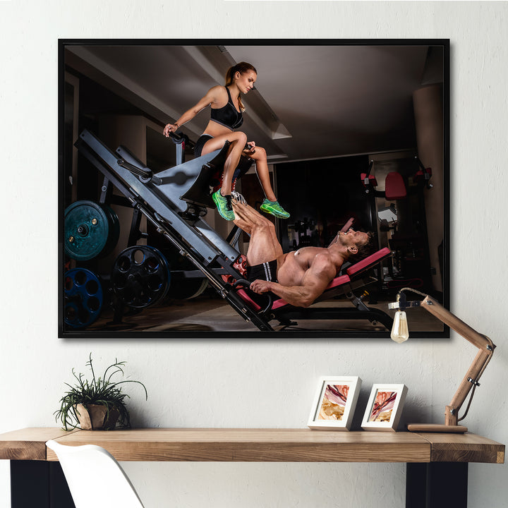 Man Doing Leg Presses With His Trainer - Aerobic &amp; Bodybuilding Canvas Wall Art