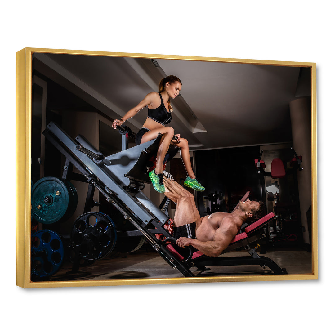 Man Doing Leg Presses With His Trainer - Aerobic &amp; Bodybuilding Canvas Wall Art