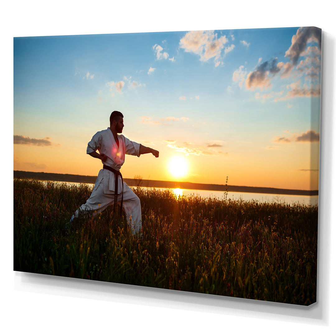 Man Training Karate In Field At Sunrise - Aerobic &amp; Bodybuilding Canvas Wall Art