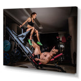 Man Doing Leg Presses With His Trainer - Aerobic & Bodybuilding Canvas Wall Art