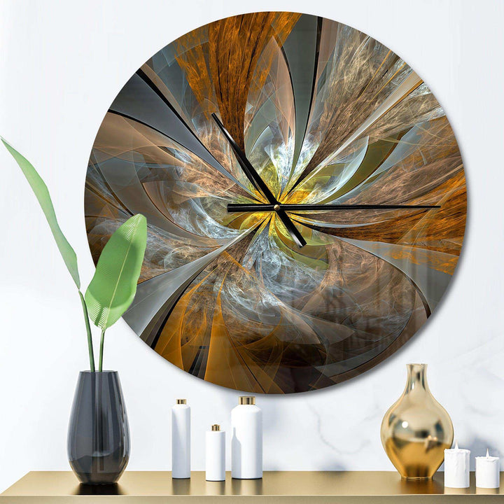 Abstract wall clock with artistic design on a white wall, featuring decorative vases and plants.