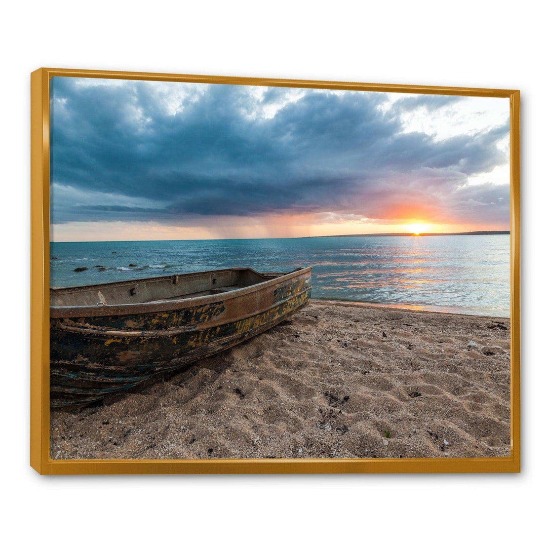 Rusty Row Boat on Sand at Sunset