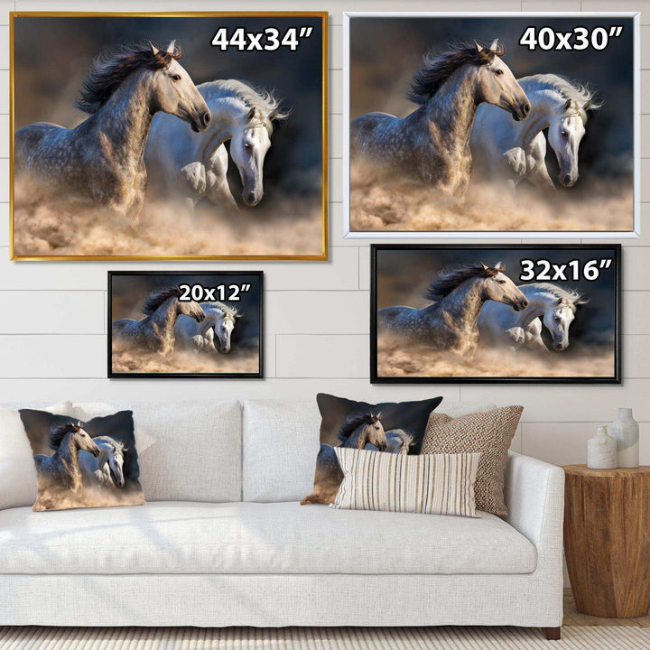 Horses run in dust