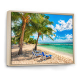 Blue chairs at the tropical white sand beach