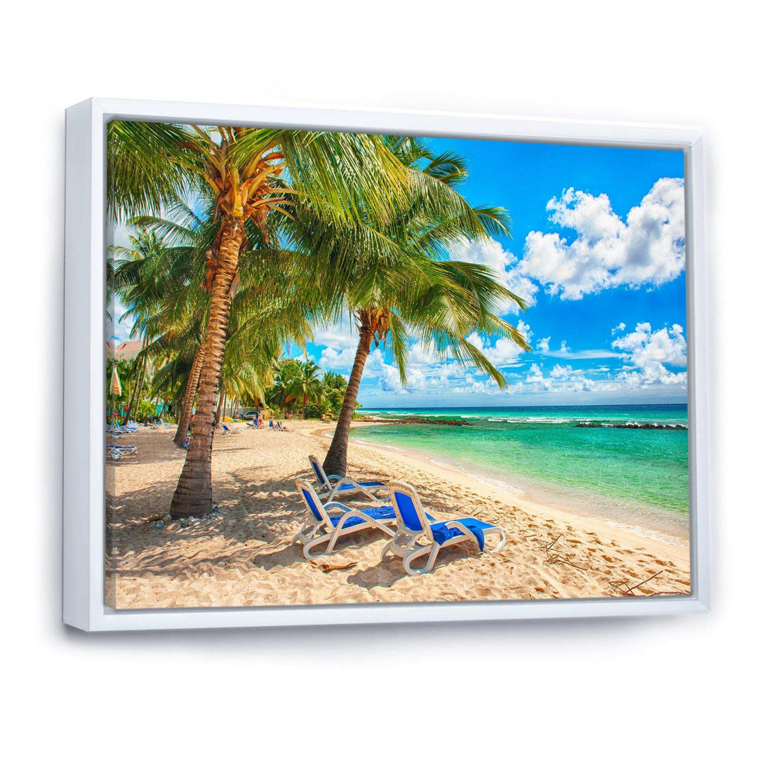 Blue chairs at the tropical white sand beach