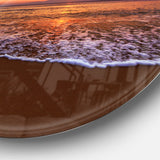 Orange Tinged Sea Waters at Sunset Beach Photo Metal Circle Wall Art