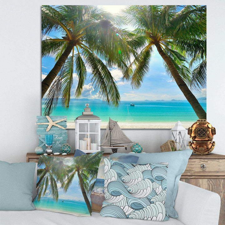 Palm Hanging over Sandy White Beach