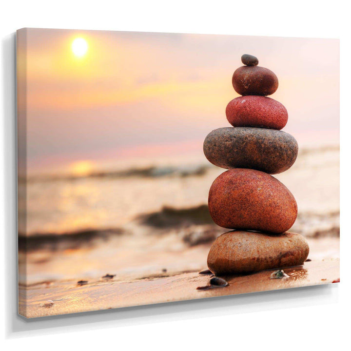Stones Pyramid on Sand Symbolizing Zen